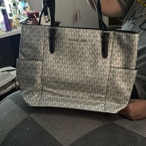 Black and grey Michael Kors purse